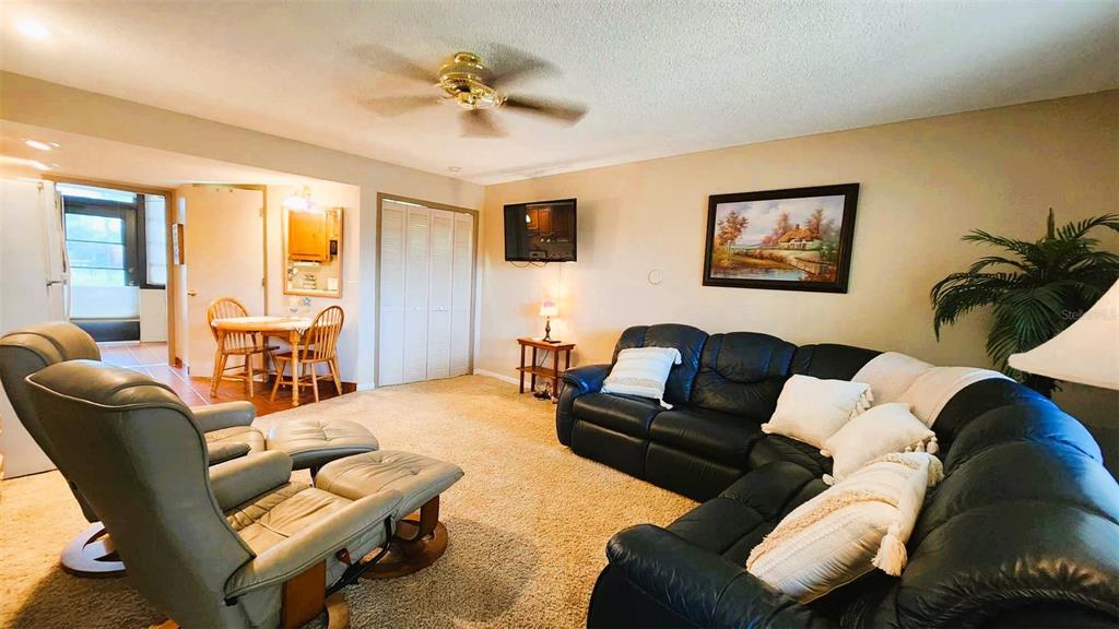 3200 River Ranch Boulevard, Unit 160 River Ranch, FL 33867 - Photo 15 of 20 a living room with furniture and a large window