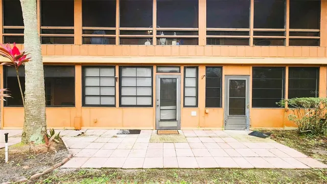 a view of a brick house with an outdoor space