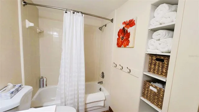 a bathroom with a bathtub and shower