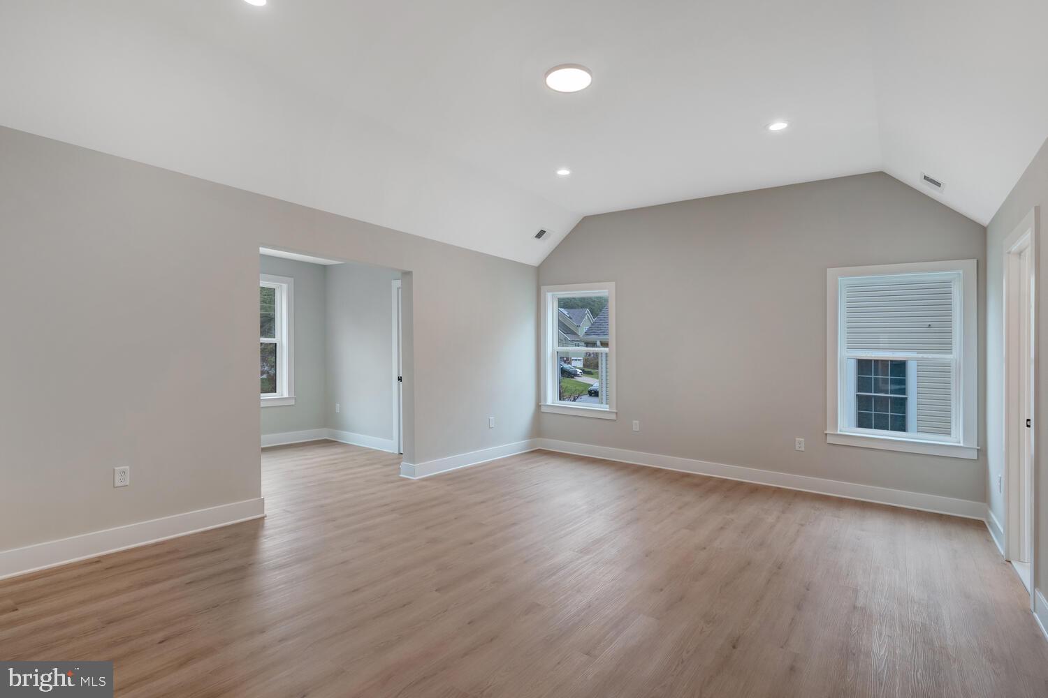 264 Schooner Road Manahawkin, NJ 08050 - Photo 11 of 37 a view of an empty room with wooden floor and a window