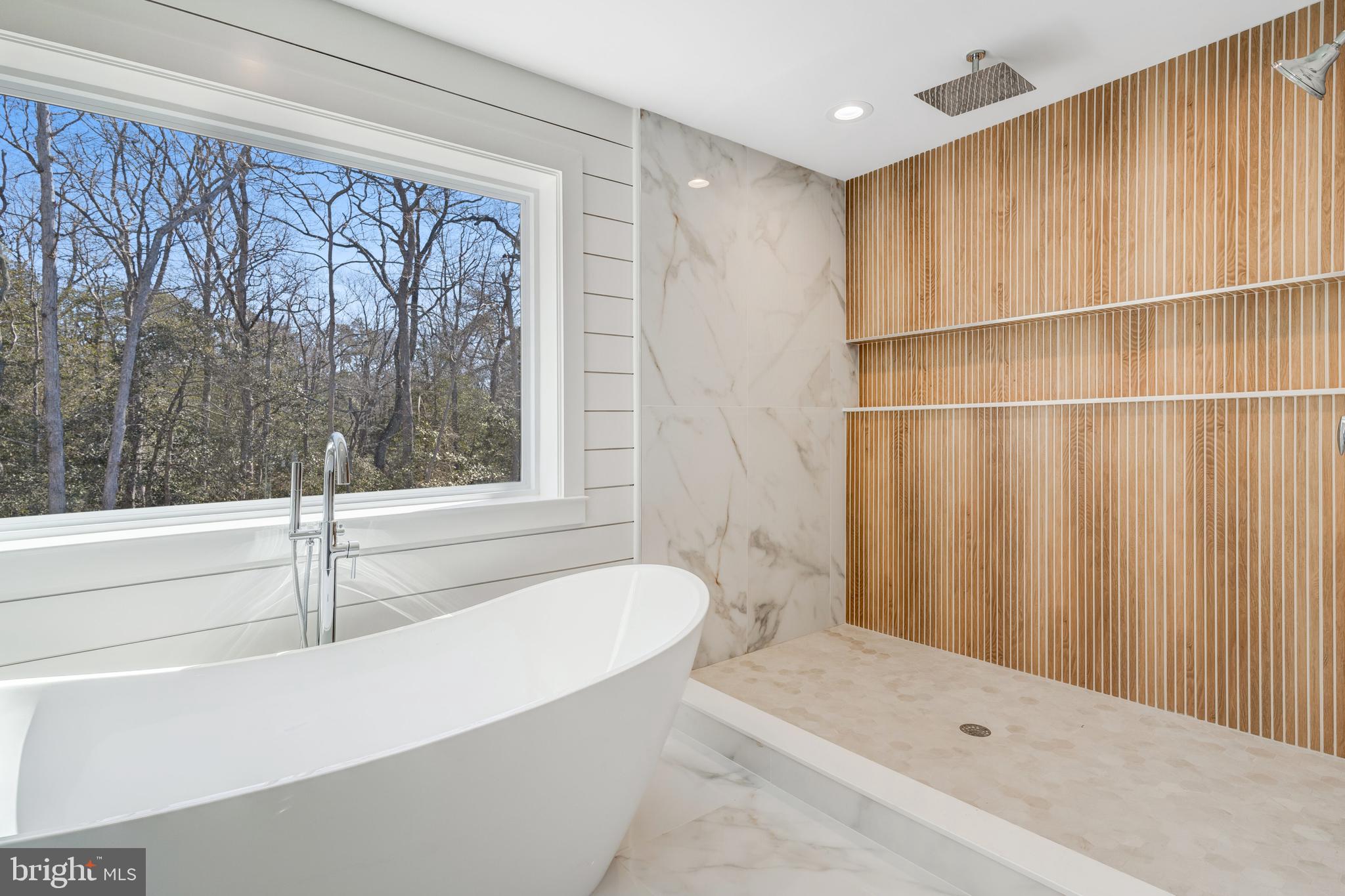 264 Schooner Road Manahawkin, NJ 08050 - Photo 19 of 37 a bathroom with a tub and shower