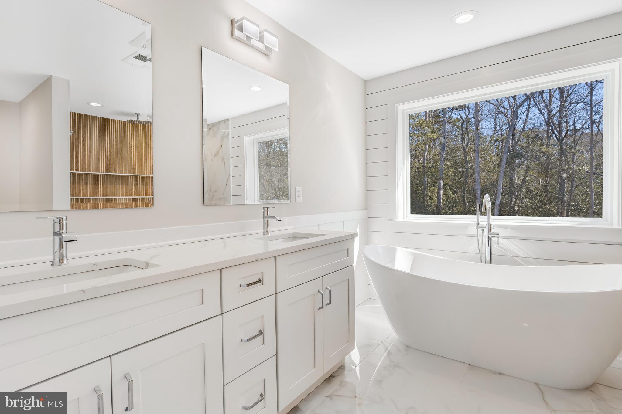 264 Schooner Road Manahawkin, NJ 08050 - Photo 20 of 37 a spacious bathroom with double vanity and a large mirror