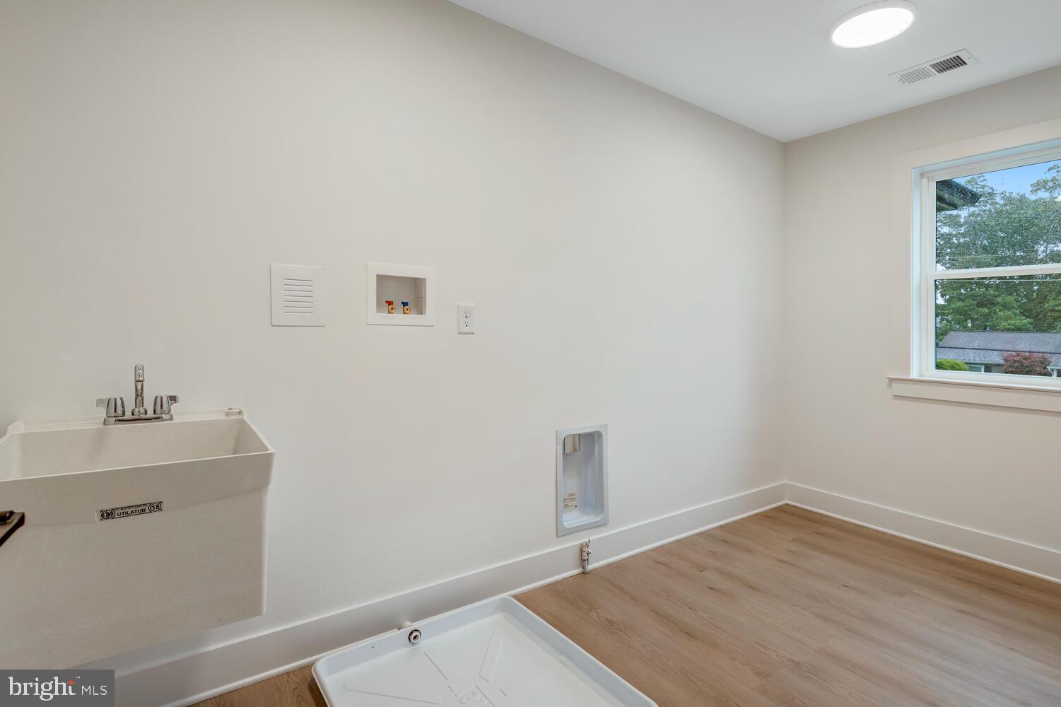 264 Schooner Road Manahawkin, NJ 08050 - Photo 28 of 37 a room with a sink and a window