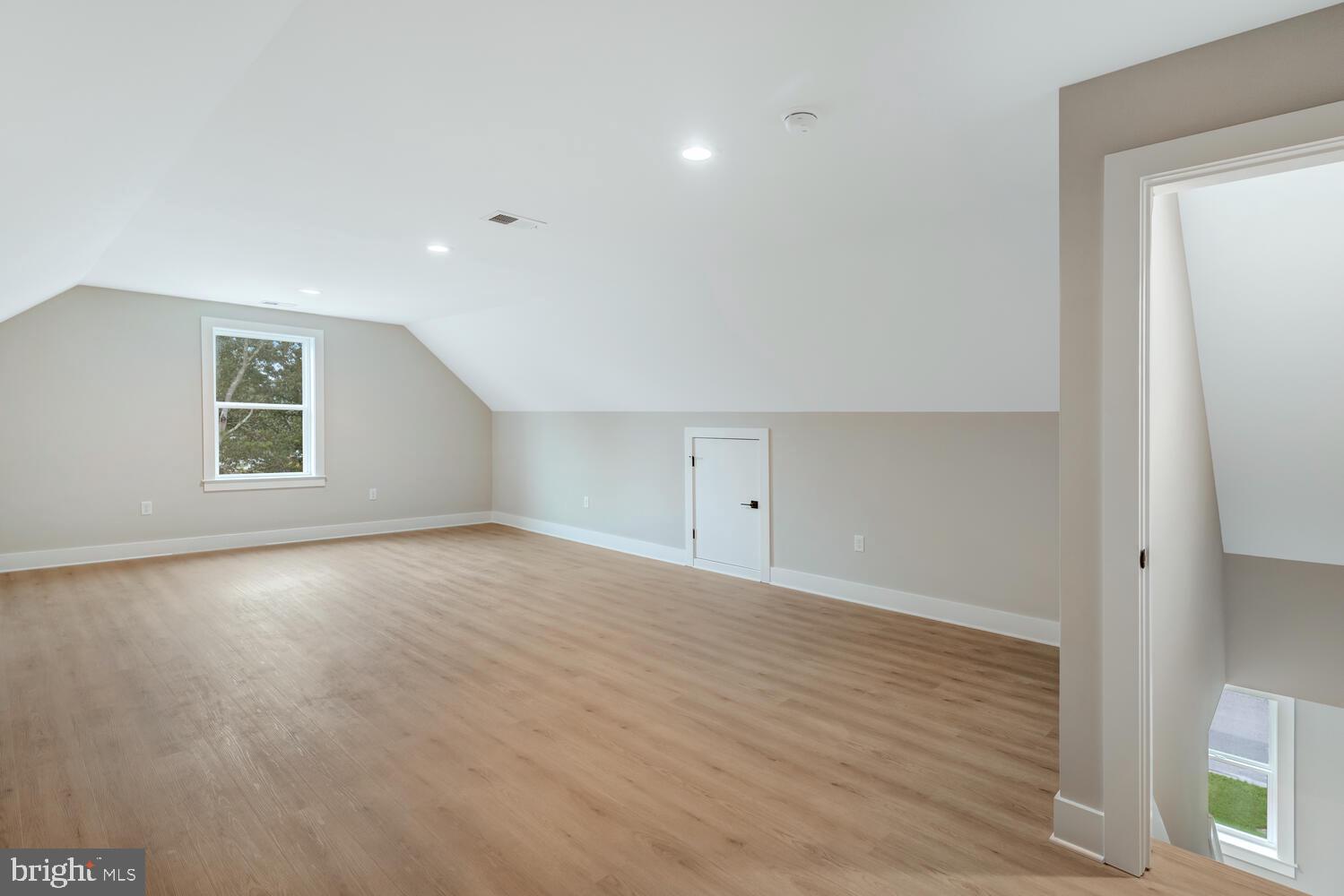 264 Schooner Road Manahawkin, NJ 08050 - Photo 29 of 37 wooden floor in an empty room with a window