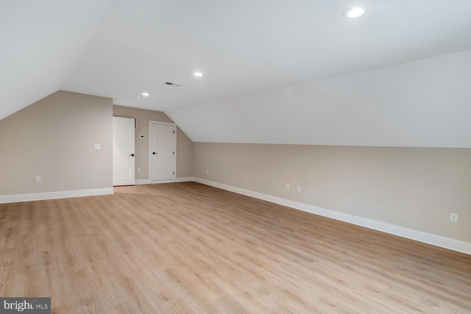 264 Schooner Road Manahawkin, NJ 08050 - Photo 30 of 37 an empty room with wooden floor and windows