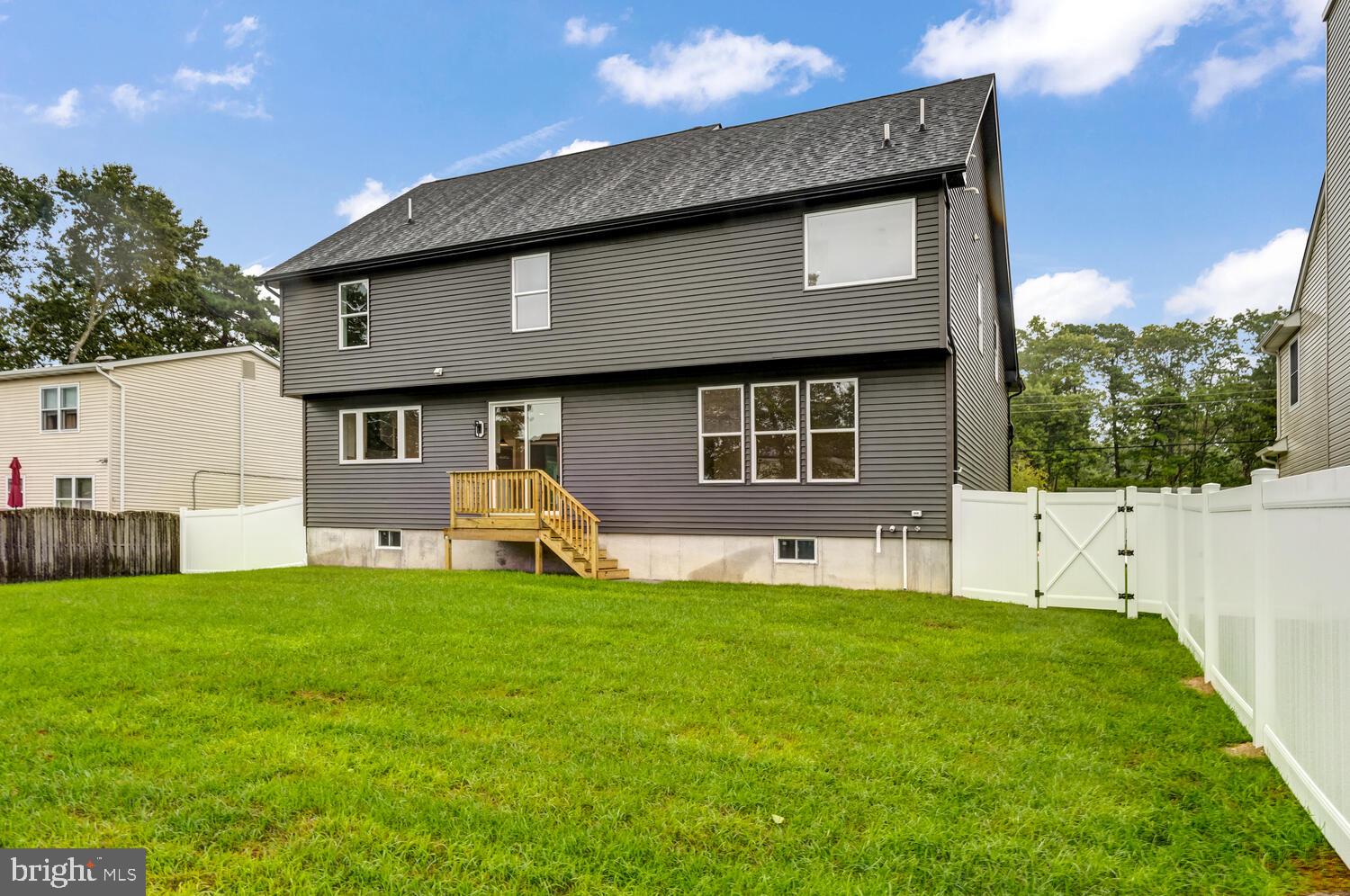 264 Schooner Road Manahawkin, NJ 08050 - Photo 34 of 37 a view of a house with a yard and sitting area