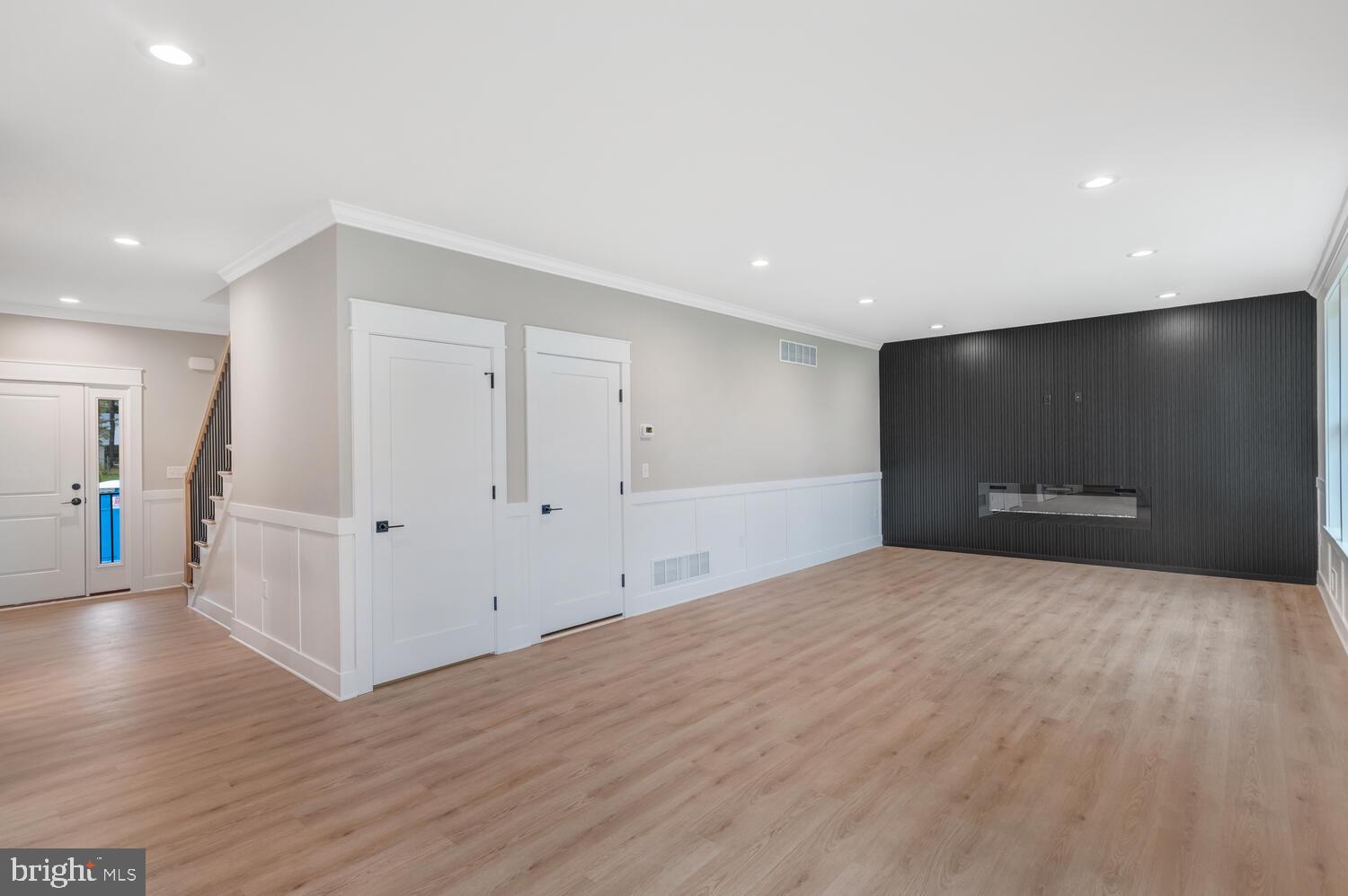 264 Schooner Road Manahawkin, NJ 08050 - Photo 4 of 37 a view of an empty room with wooden floor