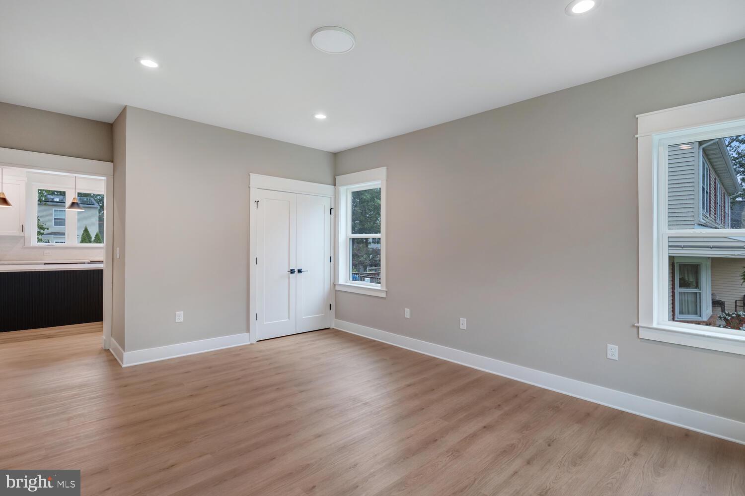 264 Schooner Road Manahawkin, NJ 08050 - Photo 9 of 37 a view of an empty room with wooden floor and windows