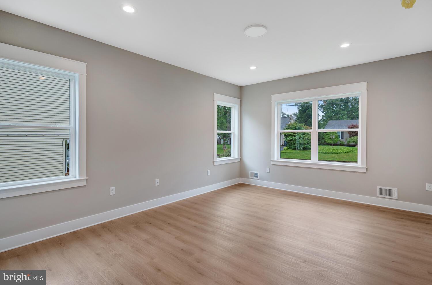 264 Schooner Road Manahawkin, NJ 08050 - Photo 10 of 37 a view of an empty room with wooden floor and a window