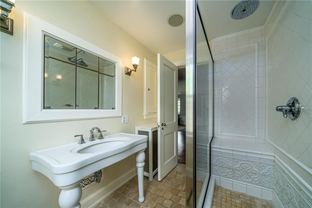 604 Pine Road Sewickley, PA 15143 - Photo 15 of 24 a bathroom with a sink and a mirror