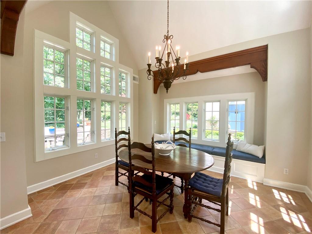 604 Pine Road Sewickley, PA 15143 - Photo 7 of 24 a view of a dining room with furniture wooden floor and chandelier