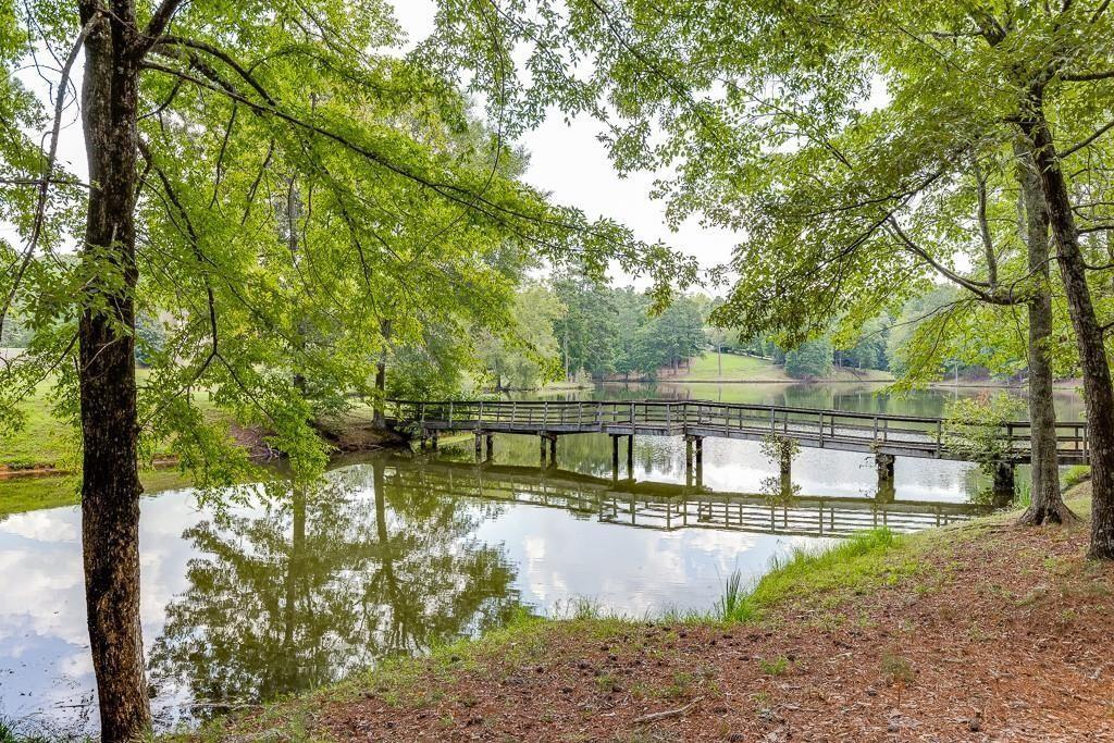 5775 Kennedy Road Suwanee, GA 30024 - Photo 5 of 23 a view of house with a yard
