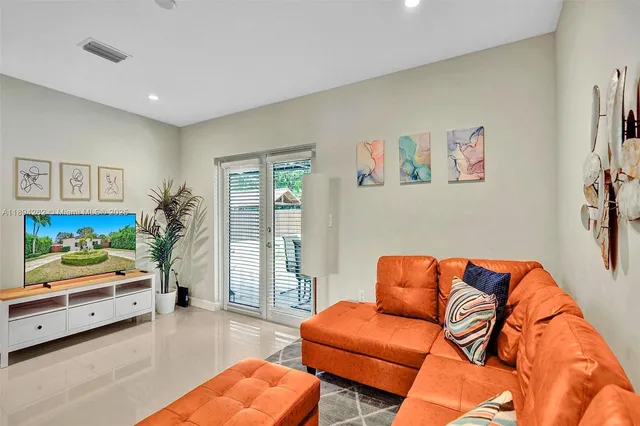 a blue room with furniture and a couch