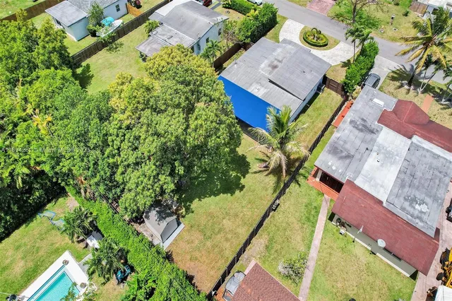an aerial view of a house with a garden