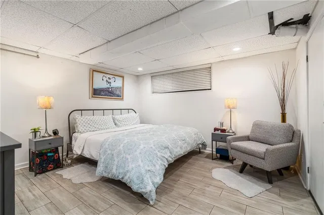 a bedroom with bed and a couch