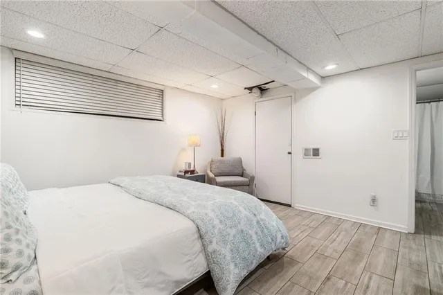 a bedroom with a bed and a window