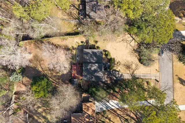 a view of a tree in front of a yard