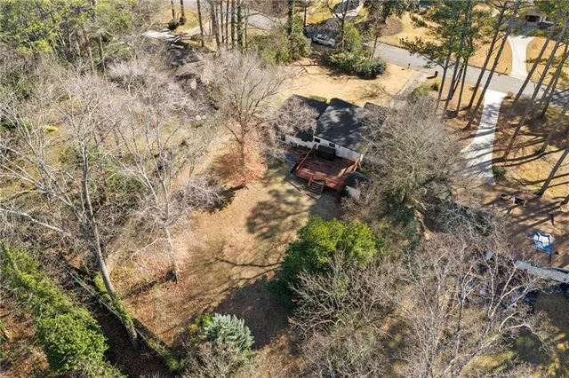 a backyard of a house with lots of trees