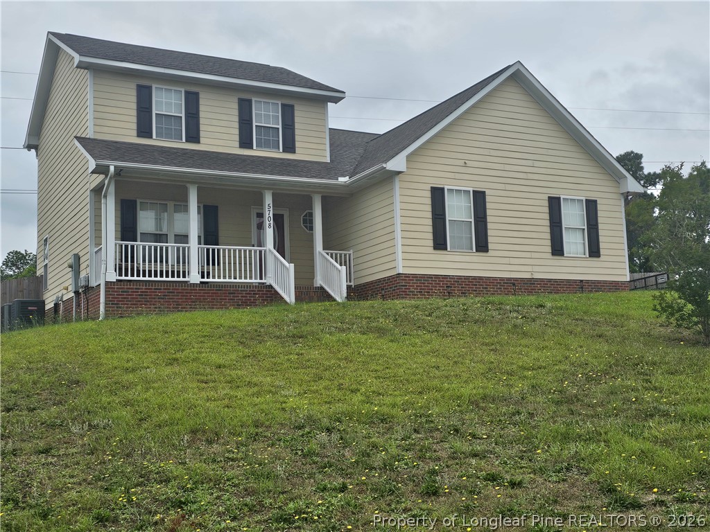 5708 Spreading Branch Road Hope Mills, NC 28348 - Photo 1 of 21 front view of a house with a yard