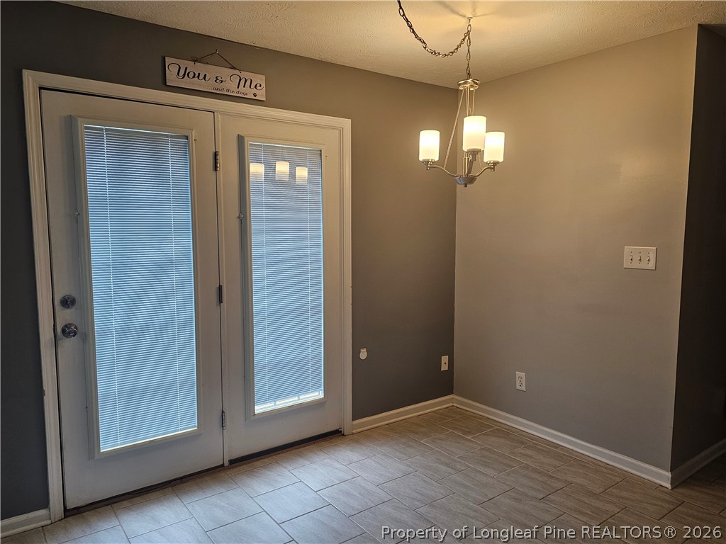 5708 Spreading Branch Road Hope Mills, NC 28348 - Photo 4 of 21 a view of empty room with window