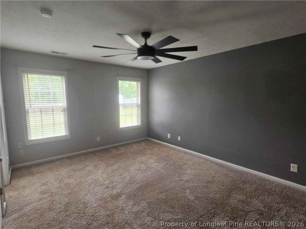 5708 Spreading Branch Road Hope Mills, NC 28348 - Photo 8 of 21 a view of an empty room with a window