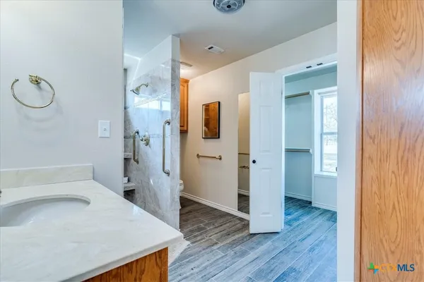 a bathroom with a sink and a mirror