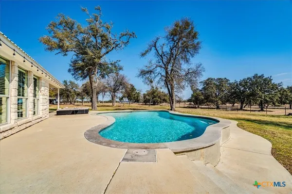 a view of outdoor space with swimming pool
