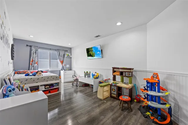 a children room with furniture and toys