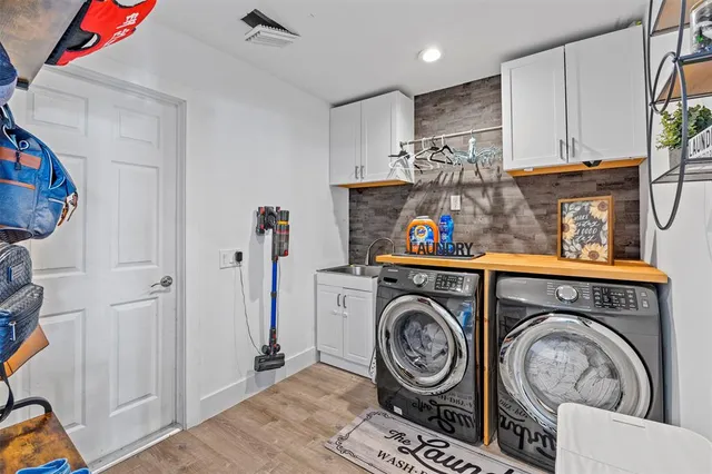 a view of livingroom with washer and dryer