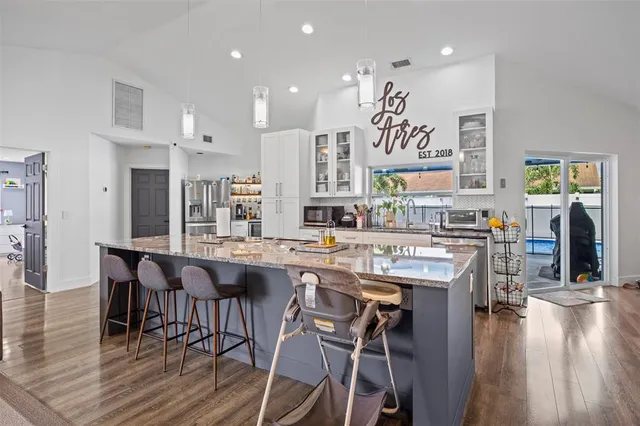 a kitchen with a table and chairs in it