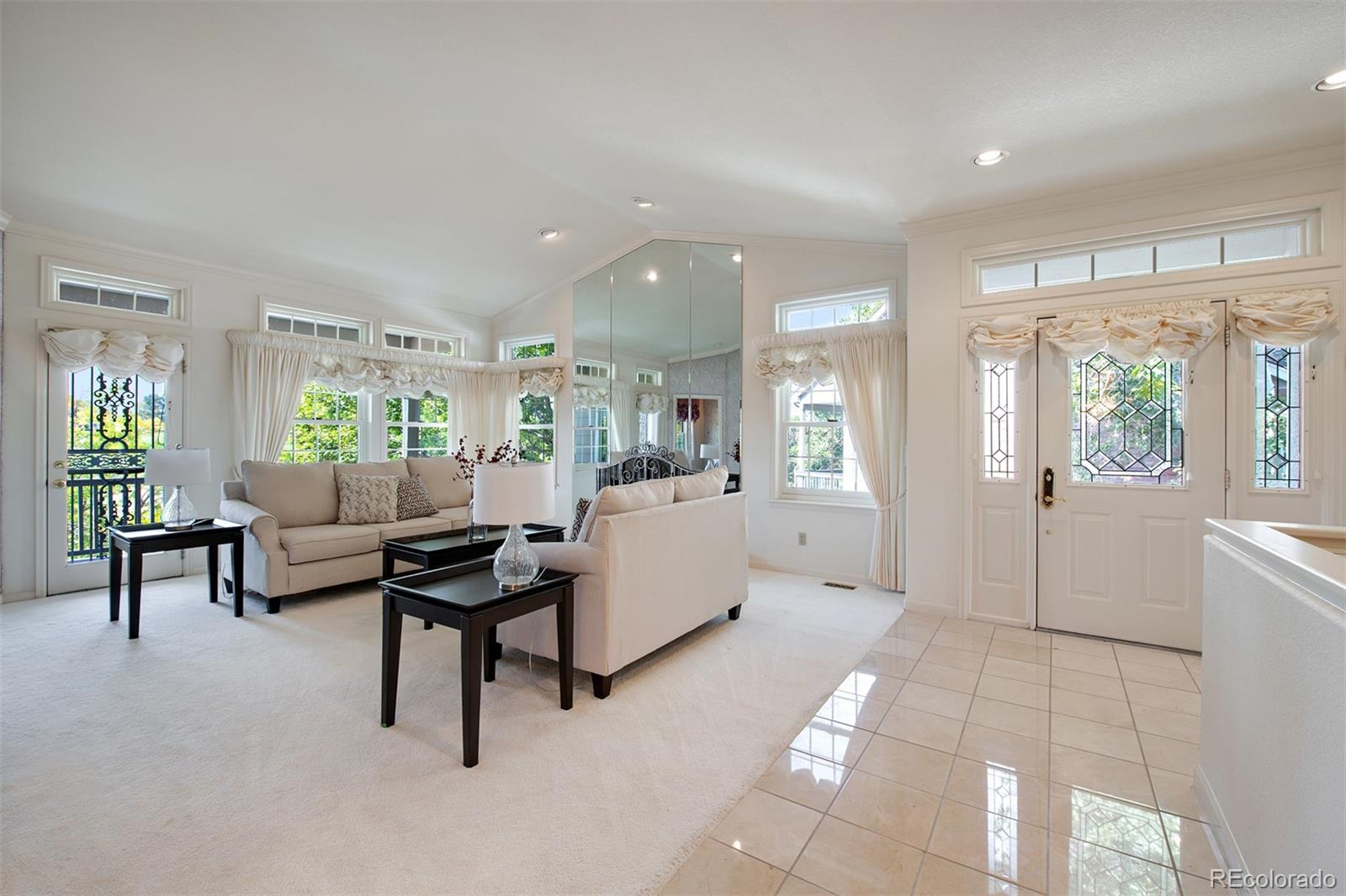 Open concept family room with vaulted ceilings and an abundance of windows and natural light!