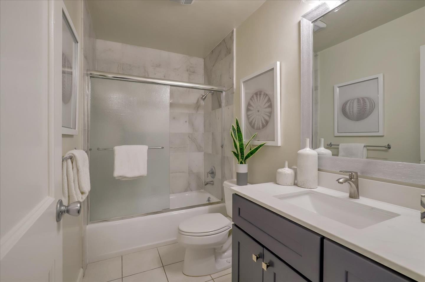 7 Embarcadero West, Unit 115 Oakland, CA 94607 - Photo 17 of 39 a bathroom with a sink a toilet and shower