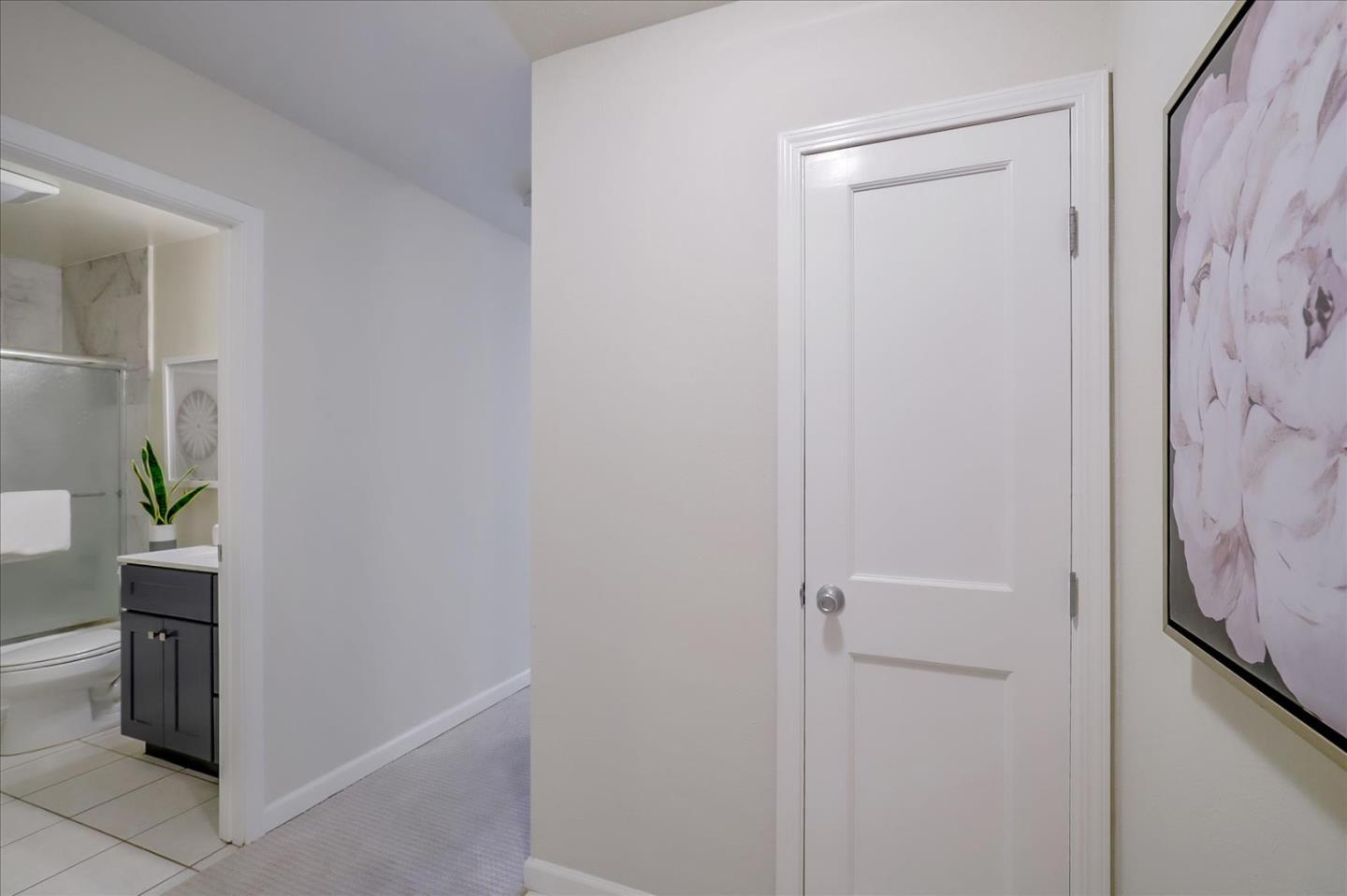 7 Embarcadero West, Unit 115 Oakland, CA 94607 - Photo 18 of 39 a room with a door and a hallway