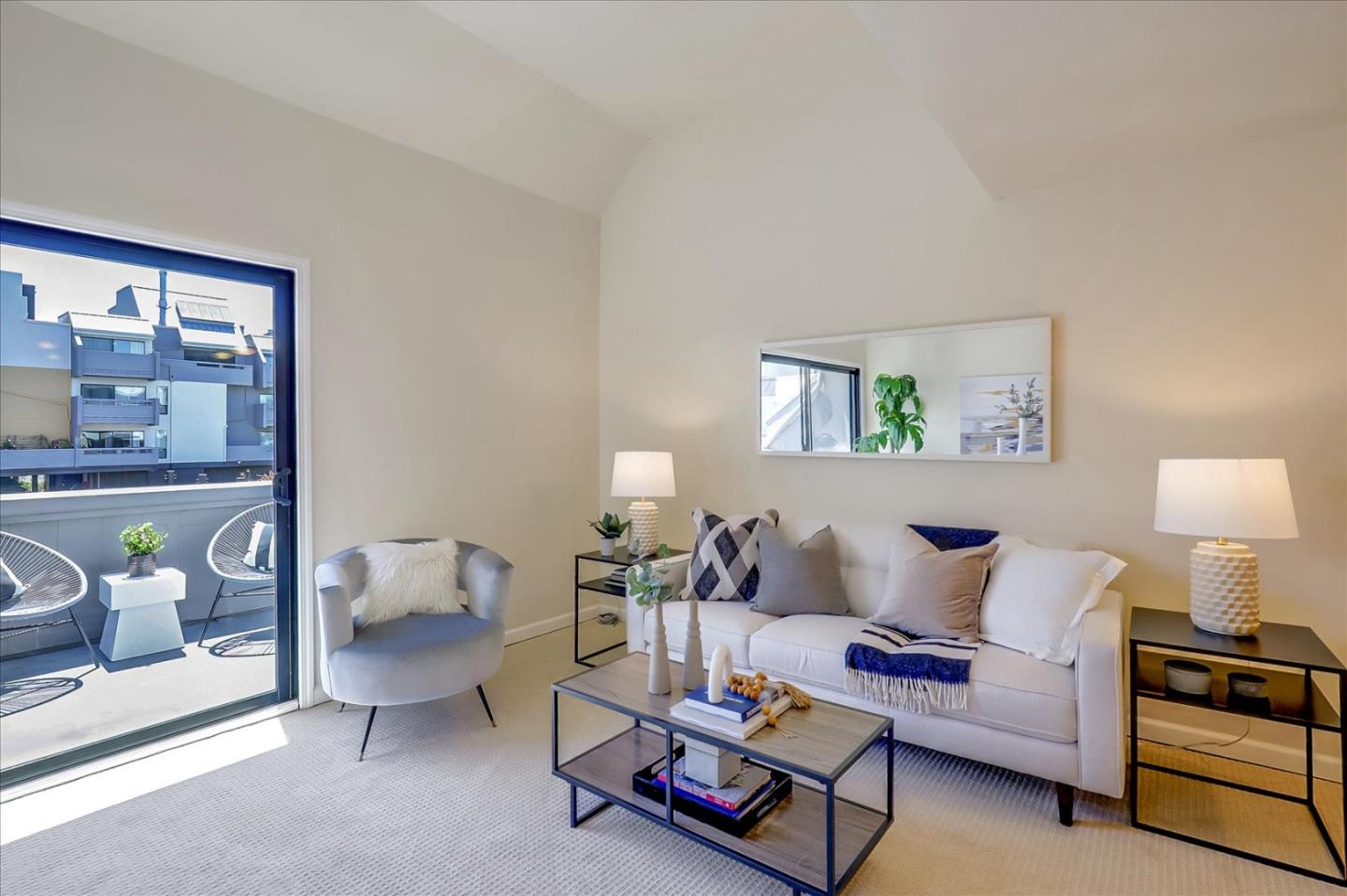 7 Embarcadero West, Unit 115 Oakland, CA 94607 - Photo 2 of 39 a living room with furniture and a lamp