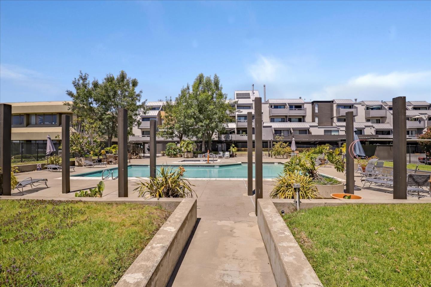 7 Embarcadero West, Unit 115 Oakland, CA 94607 - Photo 26 of 39 a view of a swimming pool with a patio