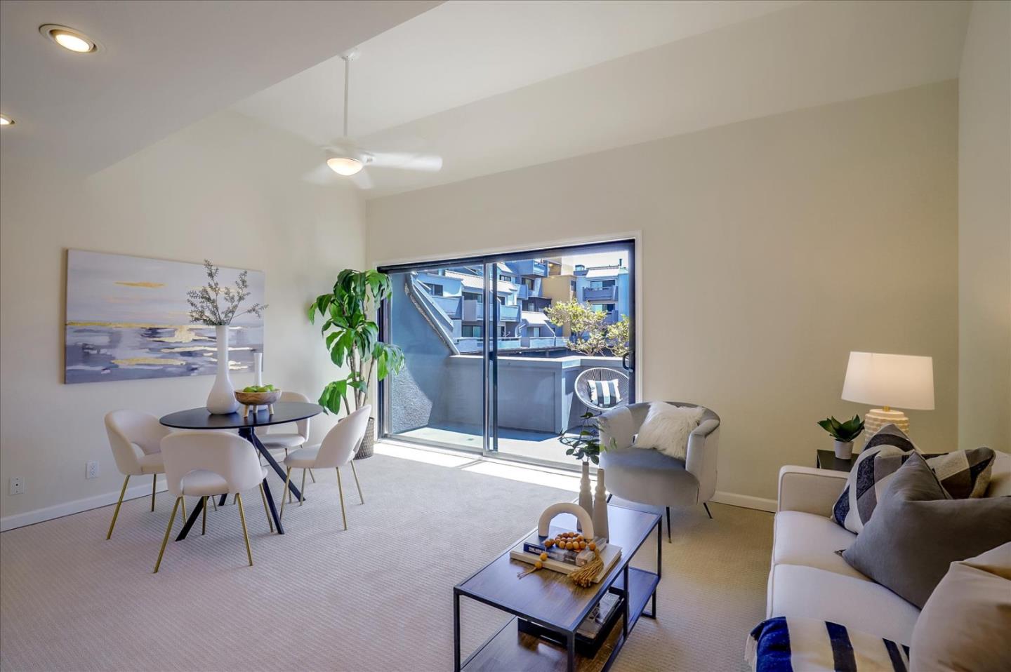 7 Embarcadero West, Unit 115 Oakland, CA 94607 - Photo 3 of 39 a living room with furniture and a painting on the wall