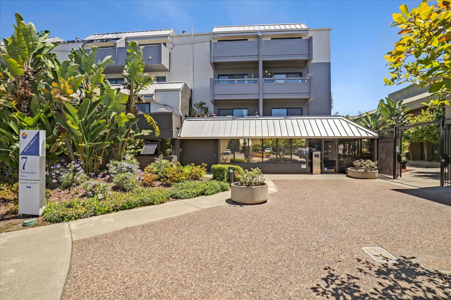 7 Embarcadero West, Unit 115 Oakland, CA 94607 - Photo 38 of 39 front view of a building with potted plants