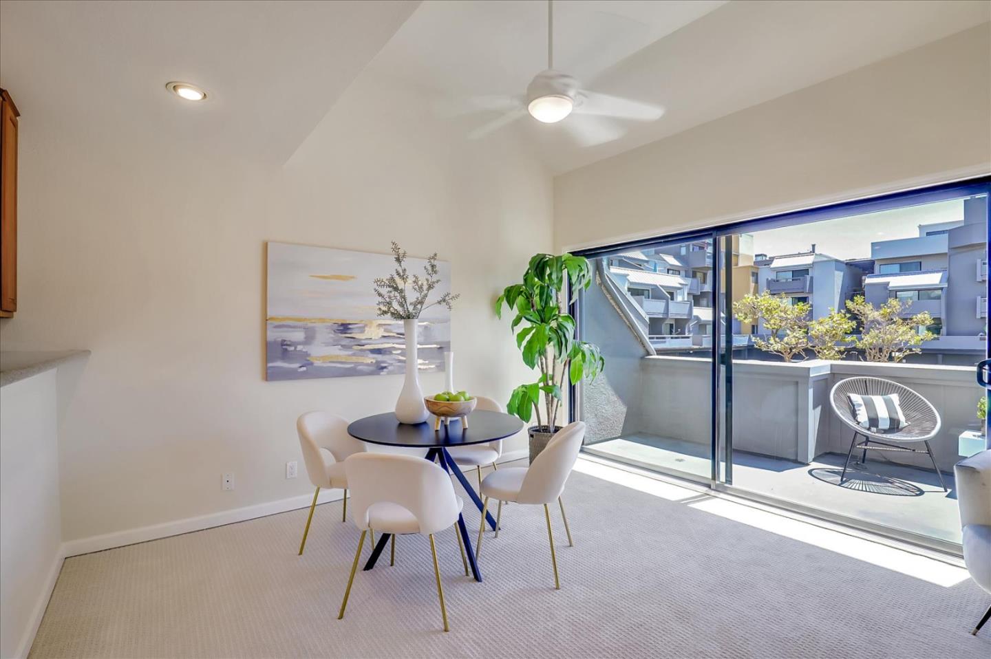 7 Embarcadero West, Unit 115 Oakland, CA 94607 - Photo 4 of 39 a dining room with furniture and a potted plant