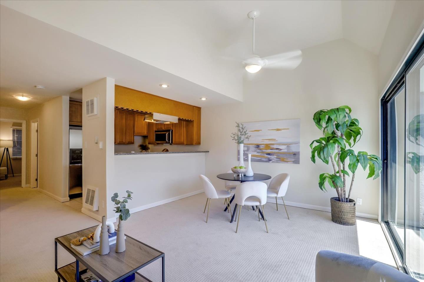 7 Embarcadero West, Unit 115 Oakland, CA 94607 - Photo 8 of 39 a living room with furniture and a potted plant