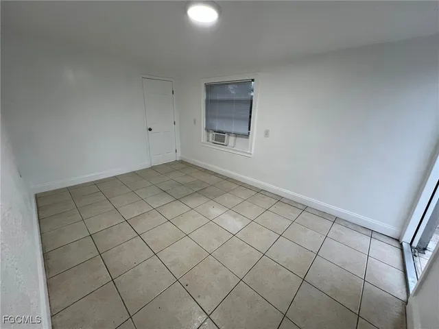 a view of a chandelier fan and closet in a room