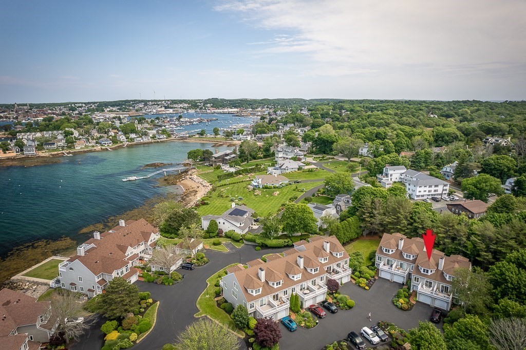 an aerial view of multiple house with yard