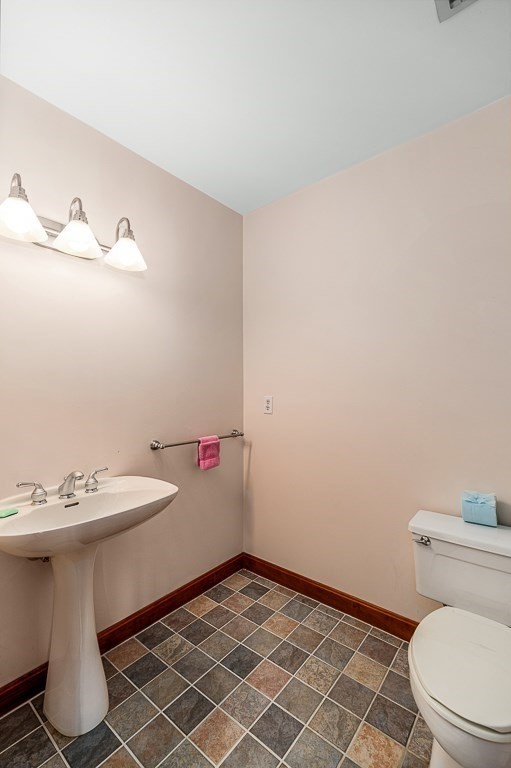 3 Raven Lane, Unit A2 Gloucester, MA 01930 - Photo 12 of 39 a bathroom with a sink toilet and vanity
