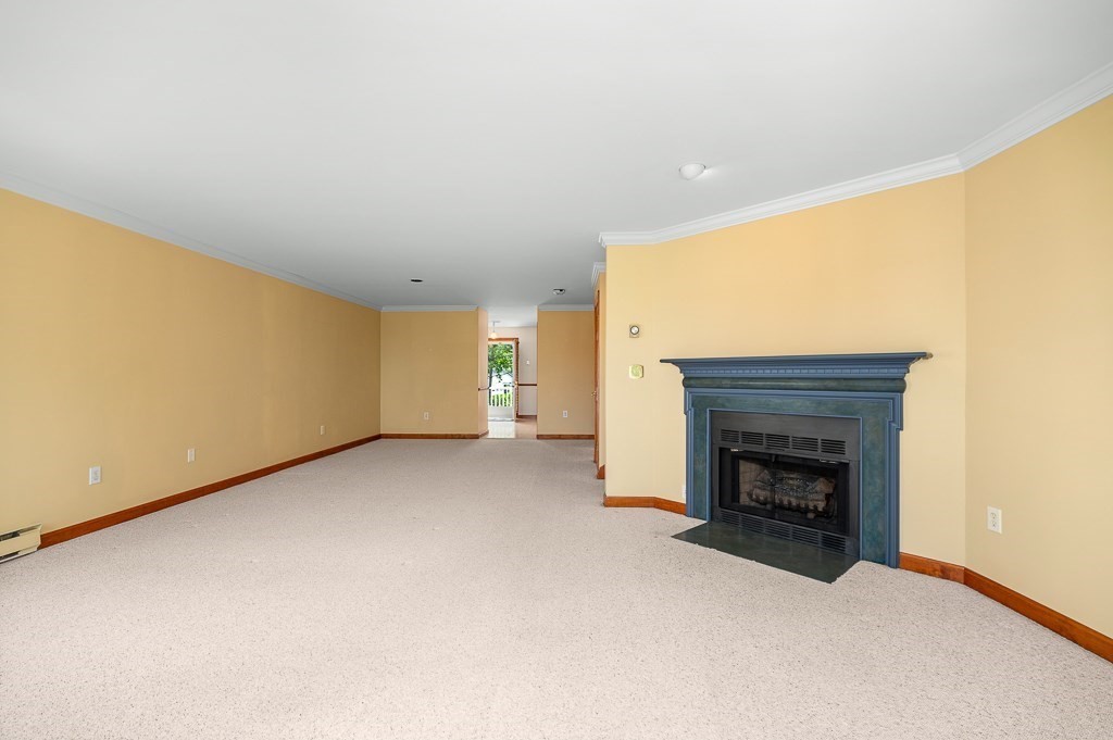 3 Raven Lane, Unit A2 Gloucester, MA 01930 - Photo 15 of 39 a view of empty room with a fireplace
