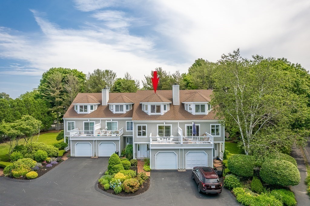 3 Raven Lane, Unit A2 Gloucester, MA 01930 - Photo 2 of 39 a aerial view of a house with a yard and potted plants