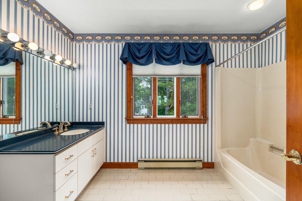 3 Raven Lane, Unit A2 Gloucester, MA 01930 - Photo 26 of 39 a bathroom with a bathtub and a sink