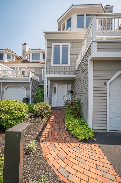 3 Raven Lane, Unit A2 Gloucester, MA 01930 - Photo 29 of 39 a front view of a house with garden