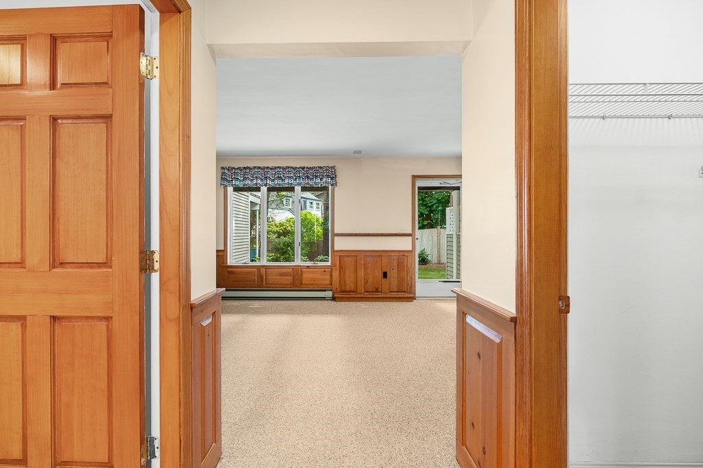 3 Raven Lane, Unit A2 Gloucester, MA 01930 - Photo 8 of 39 a view of a hallway with wooden floor and a cabinet