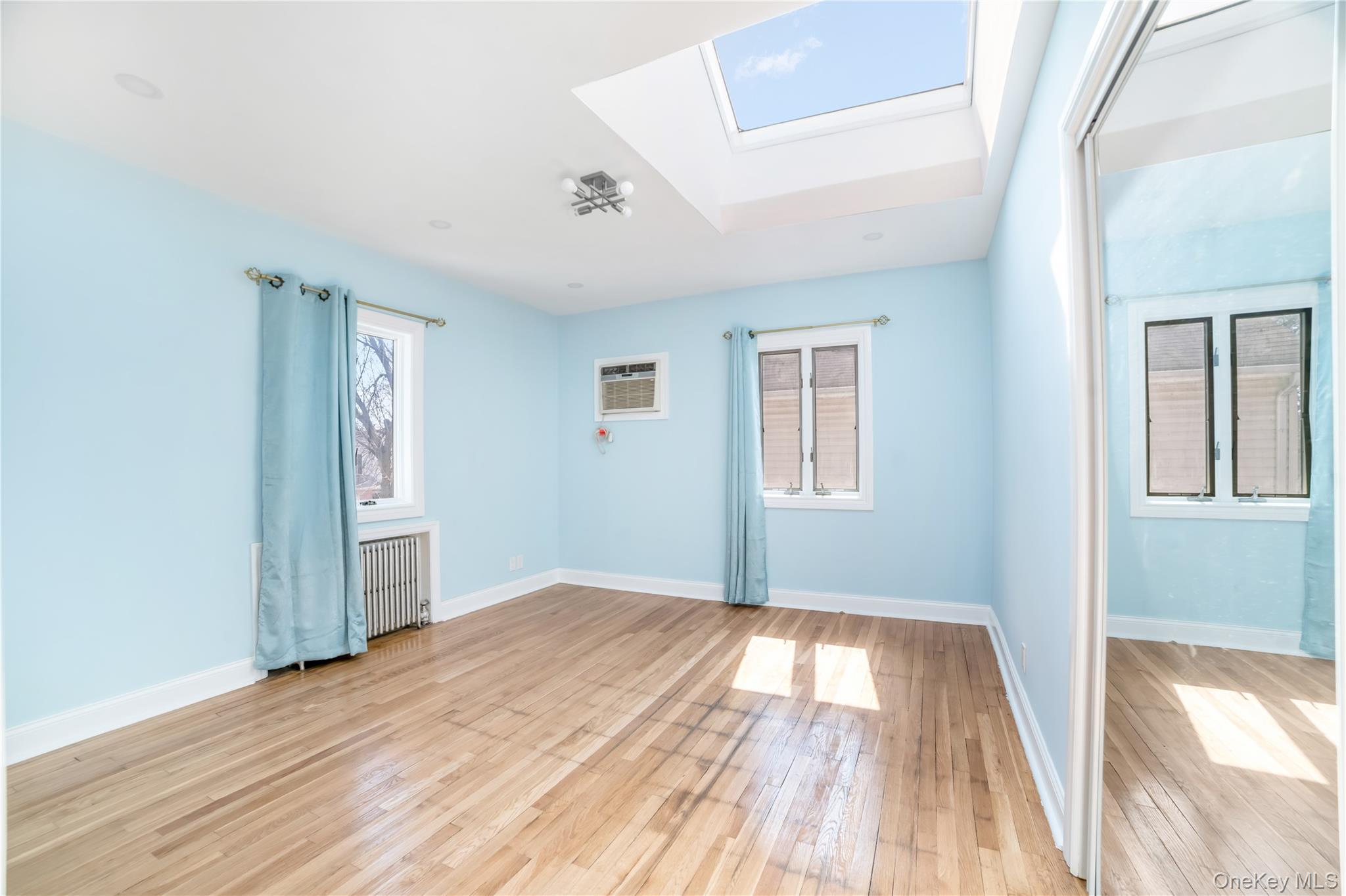 81-28 252nd Street Queens, NY 11426 - Photo 11 of 21 a view of empty room with wooden floor