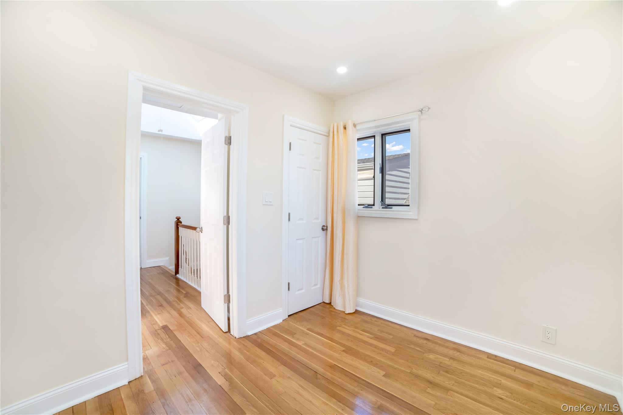 81-28 252nd Street Queens, NY 11426 - Photo 15 of 21 a view of hallway with wooden floor
