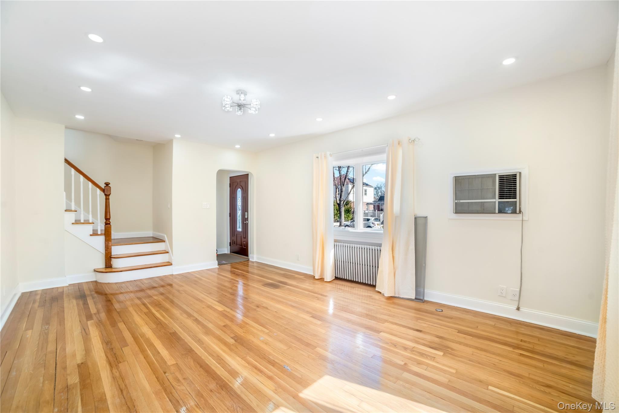 81-28 252nd Street Queens, NY 11426 - Photo 3 of 21 a view of a livingroom with wooden floor